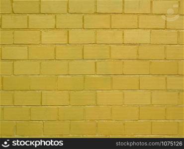 Brick wall painted in golden color as a background