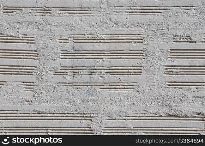 Brick wall painted with a white paint, closeup background.