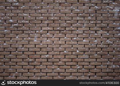 brick wall plastered with snow