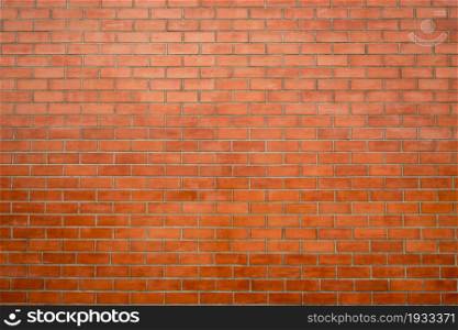 Brick wall texture background. Red brick wall wallpaper in vintage style. Orange background. Interior of brick building. Red brickwork. House construction industry background. Loft style house wall.