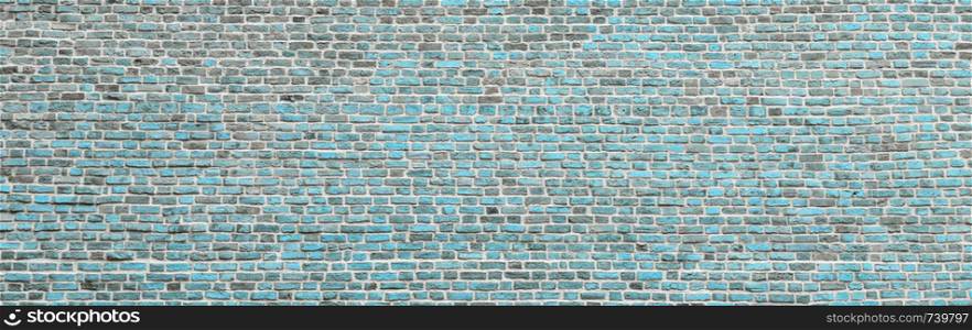 Brick wall, wide panorama of light blue masonry. Wall with small Bricks. Modern wallpaper design for web or graphic art projects. Abstract template or mock up.. Brick wall, wide panorama of masonry. Wall with small Bricks
