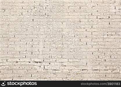 brick wall with old white paint pattern full of cracks