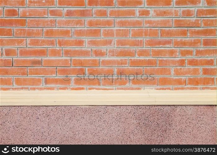 Brick wall with pink pebble cement wall