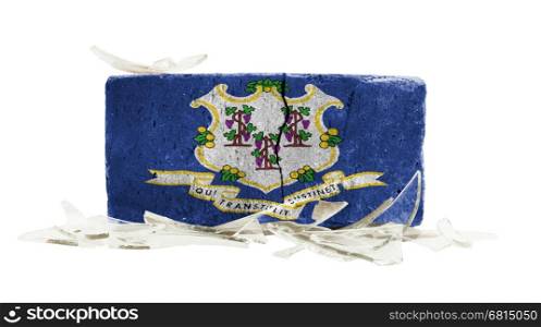 Brick with broken glass, violence concept, flag of Connecticut