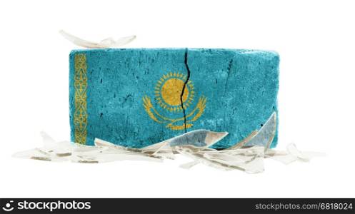 Brick with broken glass, violence concept, flag of Kazakhstan