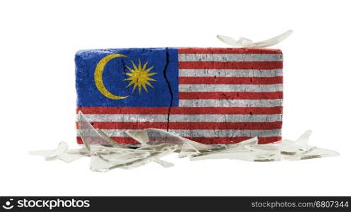 Brick with broken glass, violence concept, flag of Malaysia