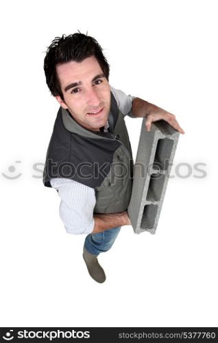 Bricklayer with a block