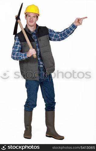 bricklayer with pickaxe pointing at something