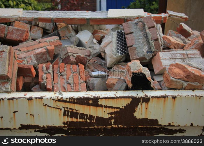 Bricks in a dumpster near a construction site, home renovation