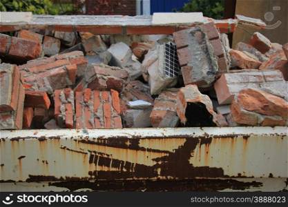 Bricks in a dumpster near a construction site, home renovation