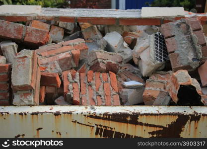 Bricks in a dumpster near a construction site, home renovation