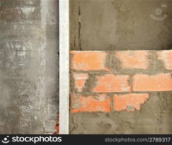 brickwall construction and mortar cement plaster with rulers