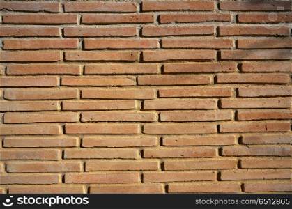 Brickwall texture detail in ocher color pattern. Brickwall texture detail in ocher color