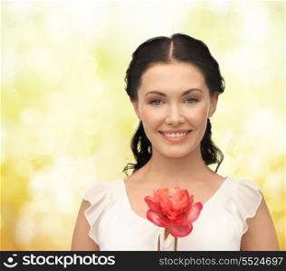 bridal and beauty concept - young and beautiful woman with flower