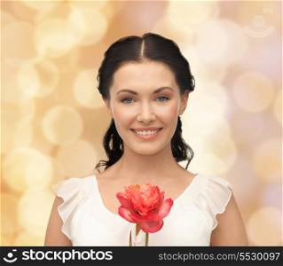 bridal and beauty concept - young and beautiful woman with flower