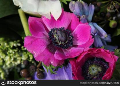 Bridal bouquet: anemones in different shades of pink and purple