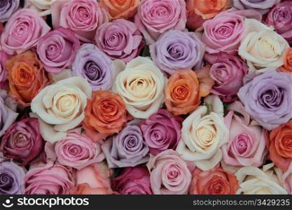 Bridal flower arrangement with roses in many pastel colors