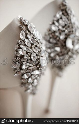 bridal high heels crystals encrusted pair of shoes on white background. wedding accessories. glitter and twinkle women high heels shoes. bridal high heels crystals encrusted pair of shoes on white background. wedding accessories. glitter and twinkle women high heels shoes.