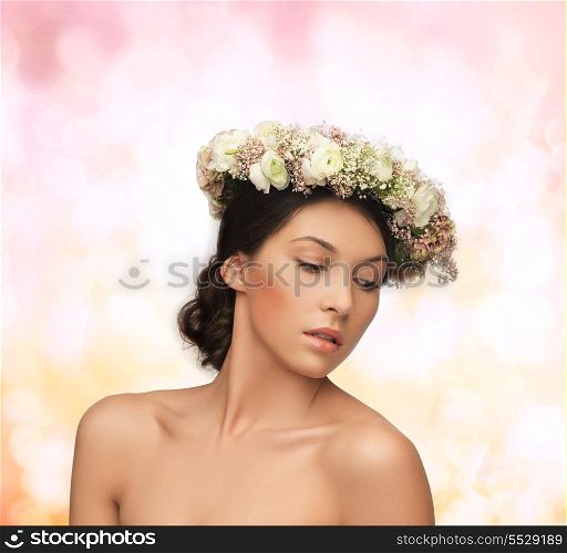 bridal, spring and beauty concept - young woman wearing wreath of flowers on abstract background