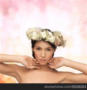 bridal, spring and beauty concept - young woman wearing wreath of flowers on abstract background