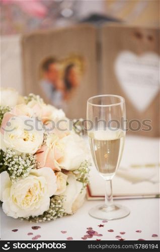 Bride&#39;s Bouquet And Glass Of Champagne On Wedding day