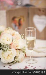Bride&#39;s Bouquet And Glass Of Champagne On Wedding day