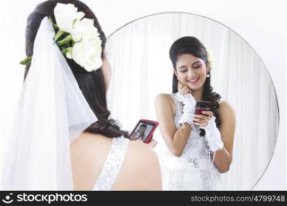 Bride admiring her own photograph