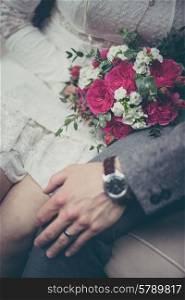 Bride and groom holding hands in vintage pastel colors