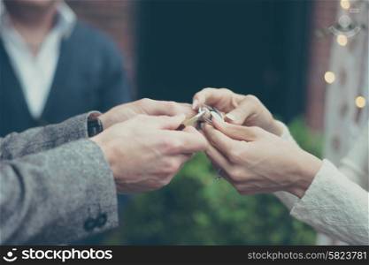 Bride and groom holding hands in vintage pastel colors
