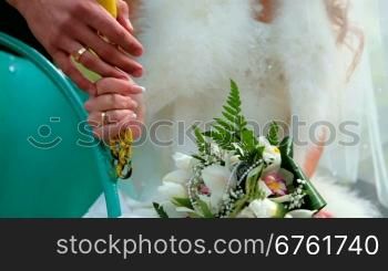 bride and groom holding hands together, Wedding rings