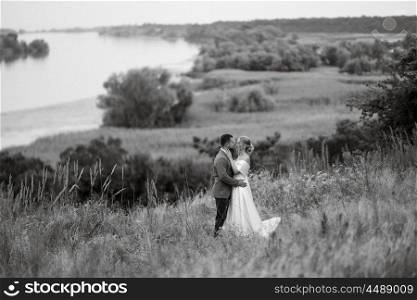 bride and groom on a walk in the woods
