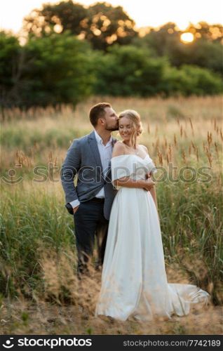 bride and groom on a walk in the woods