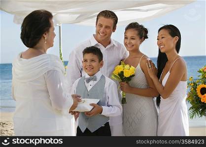 Bride and Groom on Beach With Family