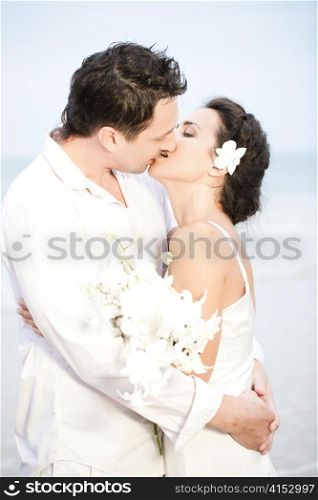 Bride and groom romantic kiss