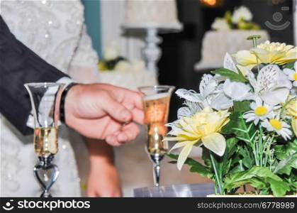 Bride and groom with glasses of champagne