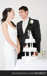 Bride and groom with wedding cake