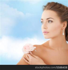 bride and wedding concept - young woman with rose flower