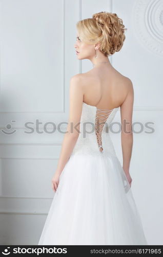 Bride. Back view. Sleeveless Wedding Dress.