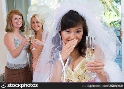 Bride celebrating at bridal shower with friends
