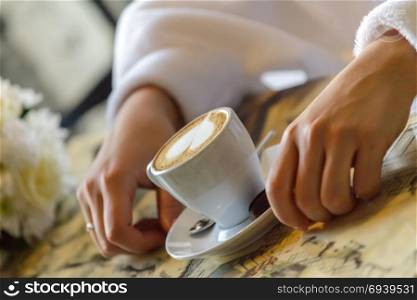 Bride drinking coffee. A cup of coffee and a spoon in bride