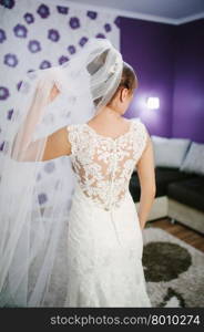 bride getting dressed on her best day ever