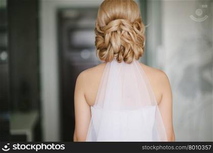 bride getting dressed on her best day ever