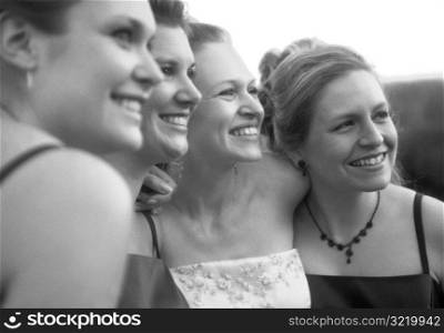 Bride Having Picture Taken With Bridesmaids