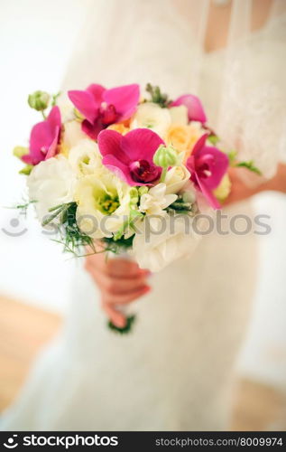 Bride holding a bouquet of beautiful flowers