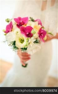 Bride holding a bouquet of beautiful flowers