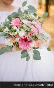 Bride holding a bouquet of flowers, wedding bouquet