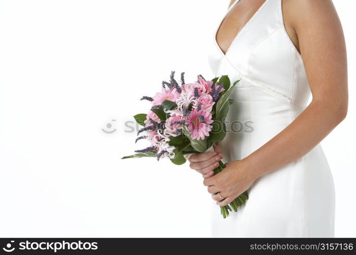 Bride Holding Bouquet Of Flowers