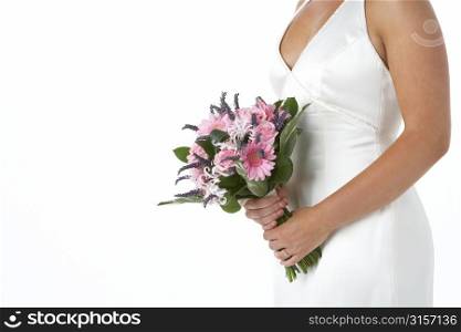 Bride Holding Bouquet Of Flowers