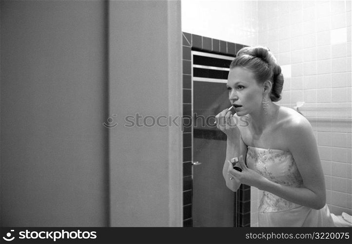 Bride In The Bathroom Putting On Lipstick