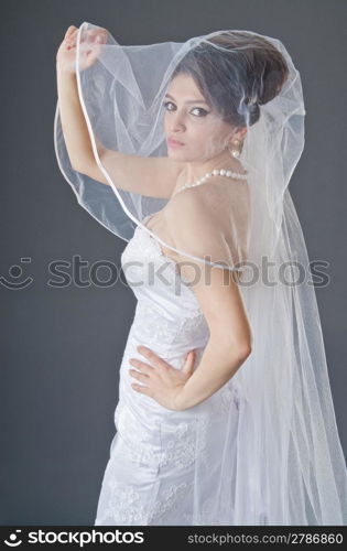 Bride in wedding dress in studio shooting